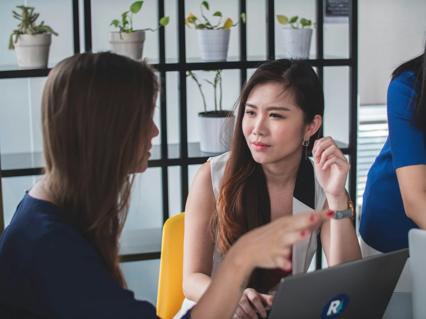 The Business Case for Banks Empowering Their Customers to Decarbonise - image of two product managers at a bank discussing new features for their banking app