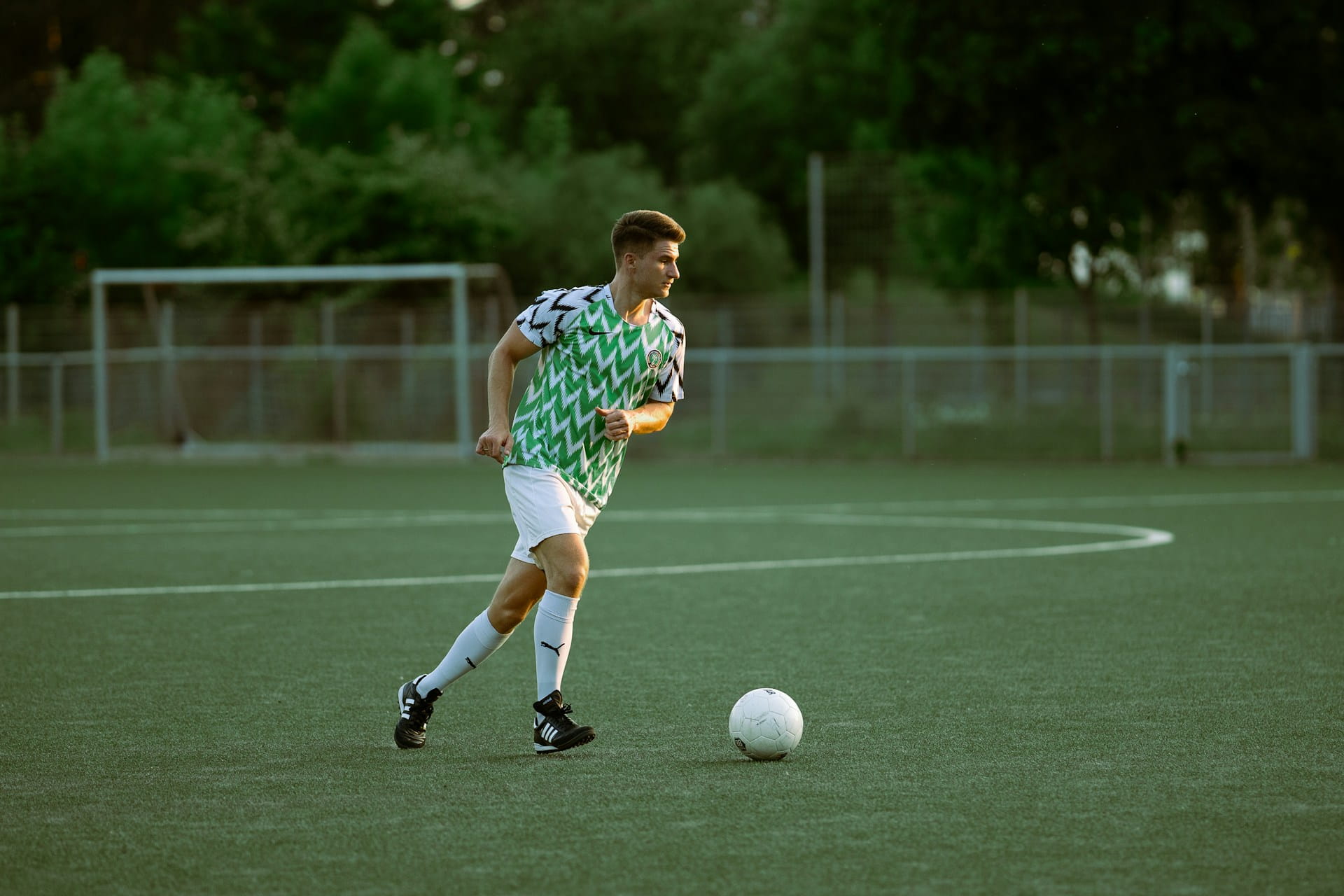 The Green Initiatives Neobanks Are Using to Stand Out (And 4 Ways to Compete) 0 image of a footballer wearing green
